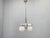 Exceptional Bauhaus chandelier from 1930s Czechoslovakia featuring a sophisticated composition of chrome-plated metal and...