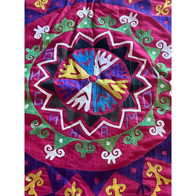 This piece is an amazing kaleidoscope of color and texture. The Suzani fabric shows some wear in places due to the nature...