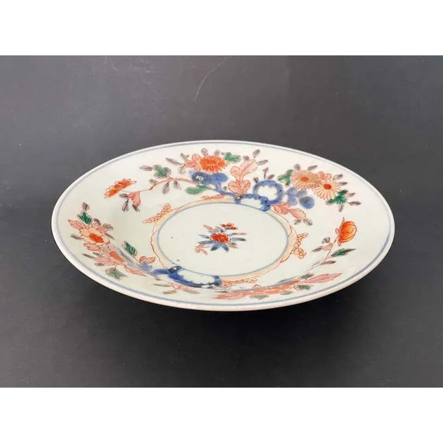 Beautiful porcelain plate with imari decoration from the 19th century. On this plate, the background is white with floral...