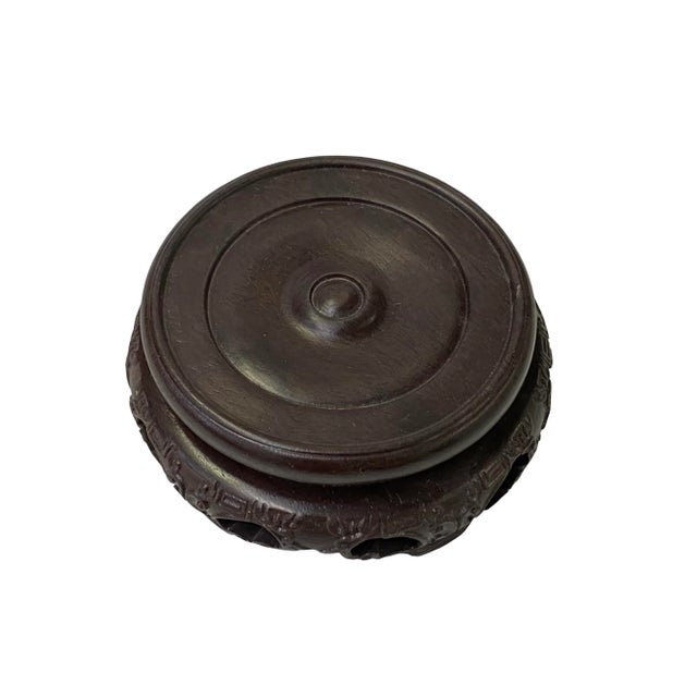 This is a handmade Chinese accent decorative display stand made of wood with relief floral motif carving. Dimensions:...