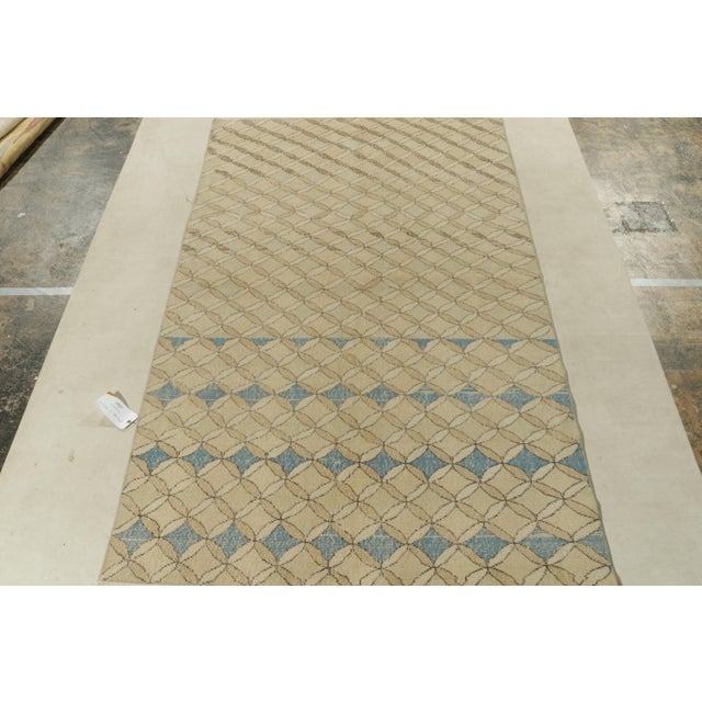 Hand-knotted in Turkey originating between 1960-1970, this vintage mid-century modern rug is the latest to join our Mid-...