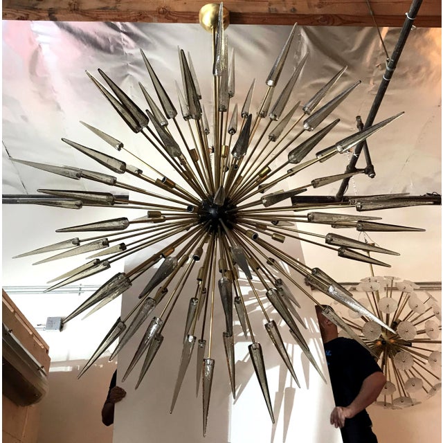 Italian modern sputnik chandelier with smoky Murano glass shards spikes, mounted on natural unlacquered brass frame with...