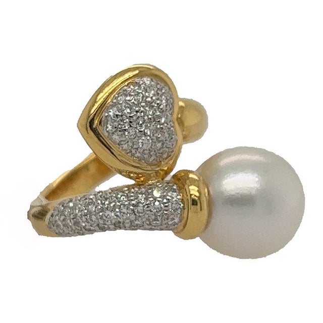 18k Bypass ring with 12mm South Sea pearl and 0.81 carats of pave set round diamonds 13.24 grams size 6.75