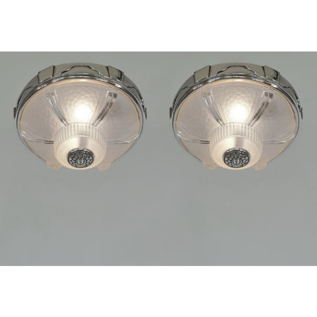 flush mounts by Etablissements Jean Gauthier - Ezan A pair of French art deco flush mounts in clear partly frosted molded-...