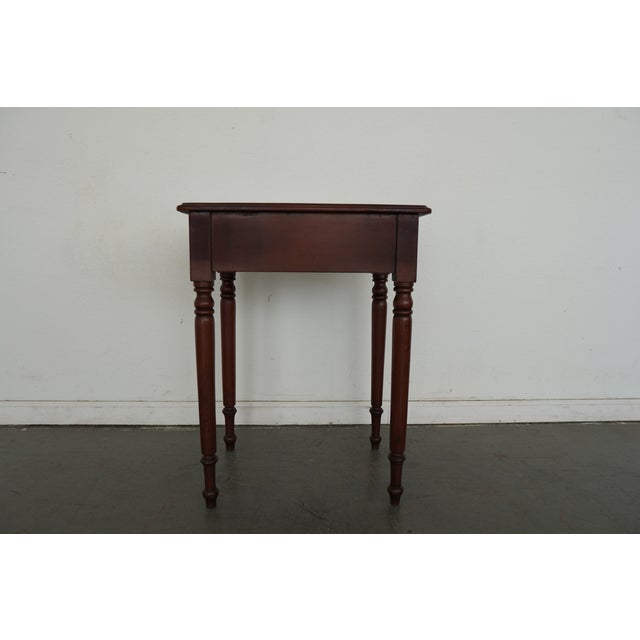 This antique late 19th century American side table is crafted in the Sheraton tradition, showcasing the refined...