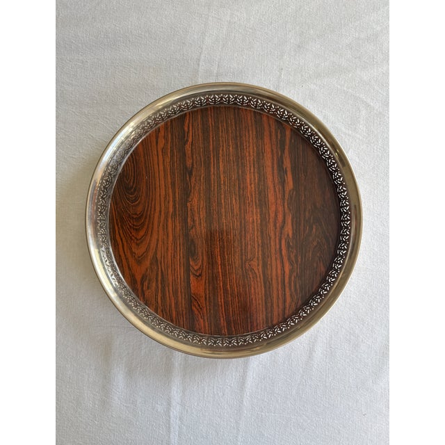 Made by English Silver Manufacturing Company, this vintage footed silver plate and formica tray is wonderful for serving...
