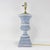 This elegant pair of urn-shaped table lamps features a weathered blue and white finish, giving them a sophisticated aged...