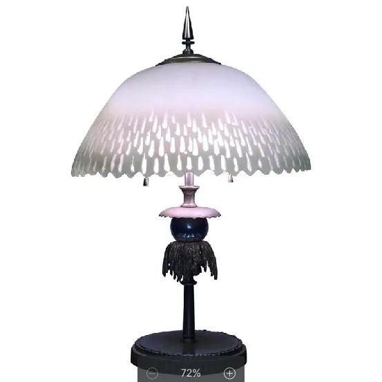 Chipped ice design glass shade that graces the nickeled bronze and chrome lamp base. Interesting skyscraper design finial....