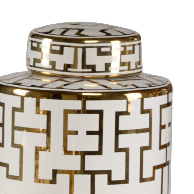 Noble canisters make an elegant decorative accent for any home. The set of three white glazed porcelain canisters feature...