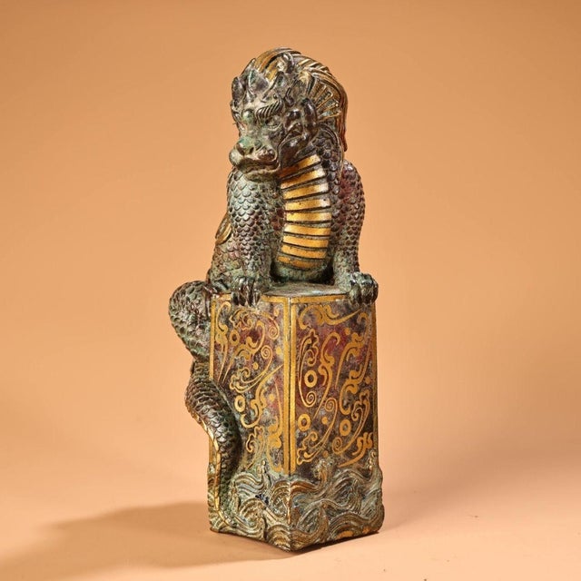 This is a finely cast antique bronze sculpture of a mythical beast, traditionally known as a water-absorbing creature. The...