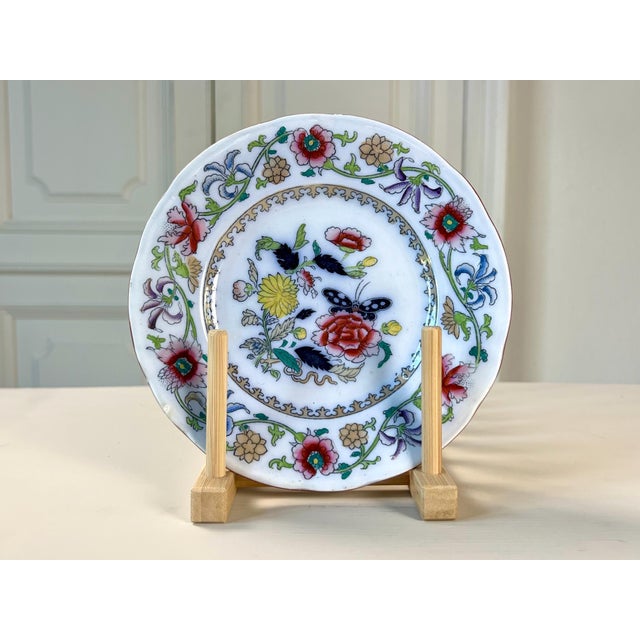 This exquisite piece of Belgian earthenware (faience) features a vibrant, hand-finished Chinoiserie design. The central...