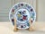 This exquisite piece of Belgian earthenware (faience) features a vibrant, hand-finished Chinoiserie design. The central...