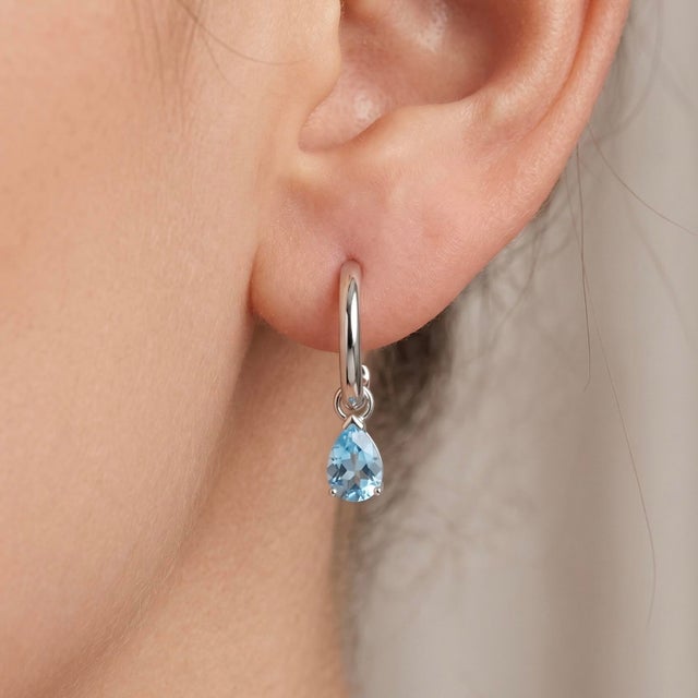 Elegant Blue Topaz Teardrop Dangle Earrings – Sterling Silver Bring a touch of sophistication and sparkle to your look...