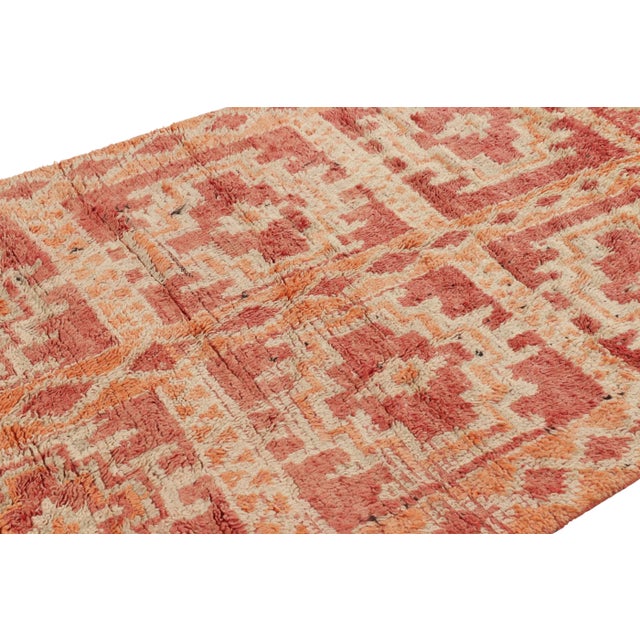 Hand-knotted in wool and originating from Morocco circa 1950-1960, this 4x6 vintage rug is a rare and among the most...