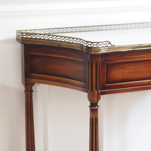 This exquisite French console table dates from the late 19th century and impresses with its original white marble top and...