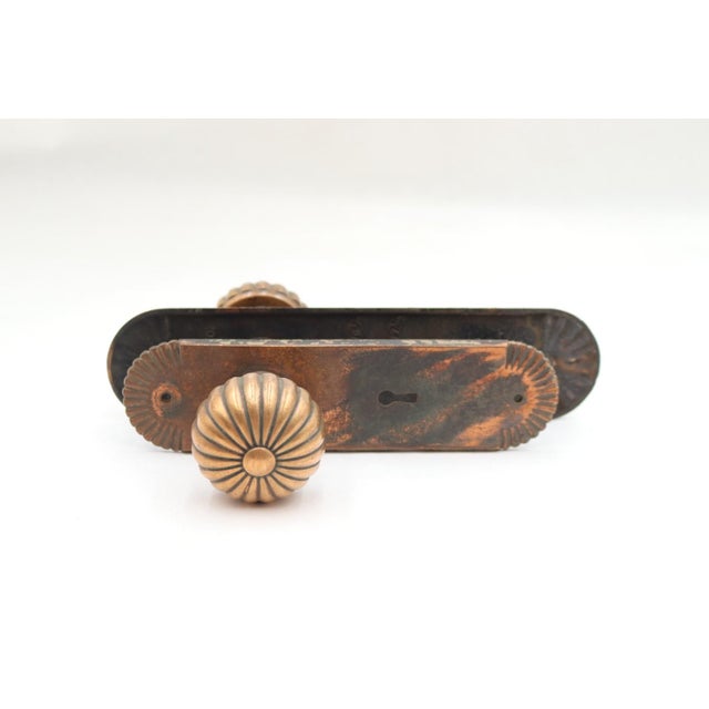 Vintage Traditional style fluted passage door knob set made of bronze with a button center. The original mounting screws...