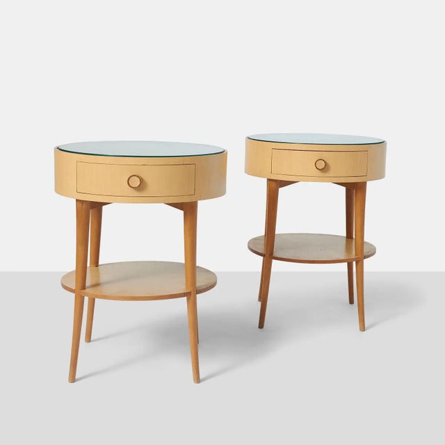 Pair of Joaquim Tenreiro Side Tables A pair of Joaquim Tenriero side tables in ivory wood with glass top. There is a lower...