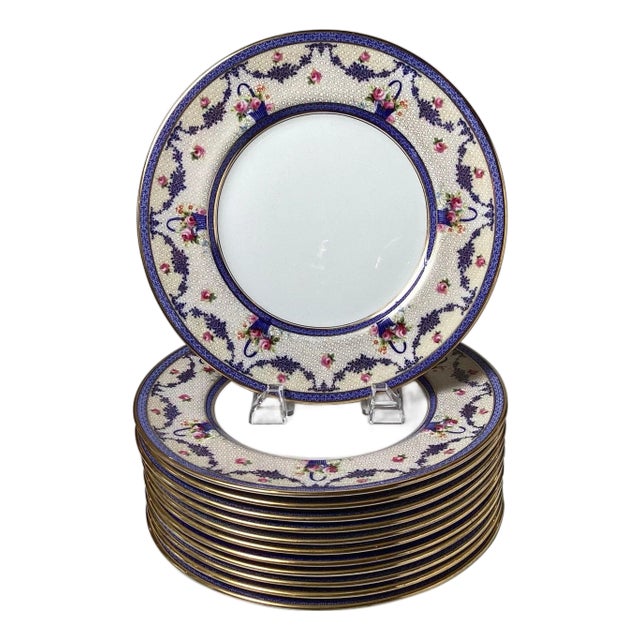 A set of twelve dinner plates by Royal Doulton, a renowned English ceramic mfg. For Sale