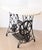 Early 20th Century SINGER treadle sewing machine console, made of cast iron. The singer base was paired with a timeless...