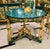 Make an unforgettable statement with this extraordinary French Empire Center Table, masterfully crafted in a rich bottle...