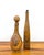 A charming pair of vintage Spanish leather-wrapped decorative bottles featuring richly embossed floral scrollwork,...