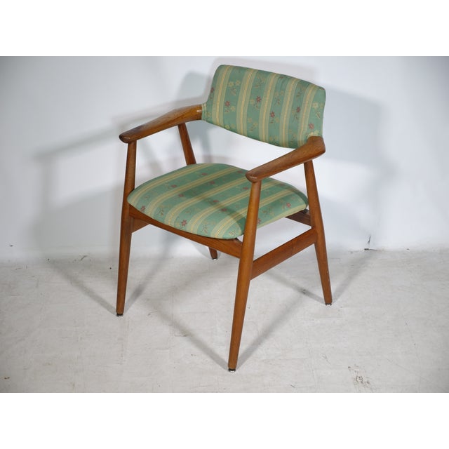 Danish mid-century armchair, model GM11, in teak by Erik Kirkegaard for Glostrup Møbelfabrik, 1960s. Solid teak frame with...