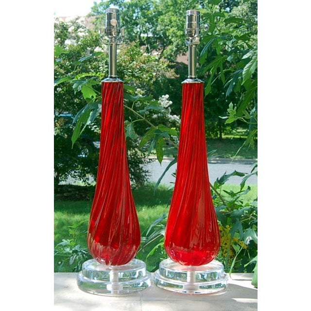 Vintage matched pair of lamps in vibrant RUBY RED, rare for Murano glass. Ribbed in a diagonal pattern. They are 24 inches...