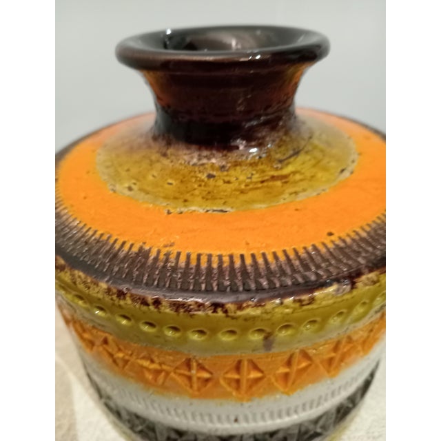 1960s vase from the famous Bitossi company of Montelupo Fiorentino, designed by Aldo Londi in 1959. Enamel in various...