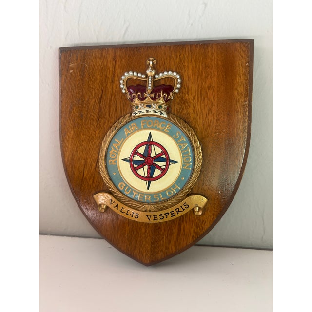 A striking vintage wooden shield commemorating the Royal Air Force Station in Gutuersloh., beautifully crafted in rich...