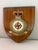 A striking vintage wooden shield commemorating the Royal Air Force Station in Gutuersloh., beautifully crafted in rich...