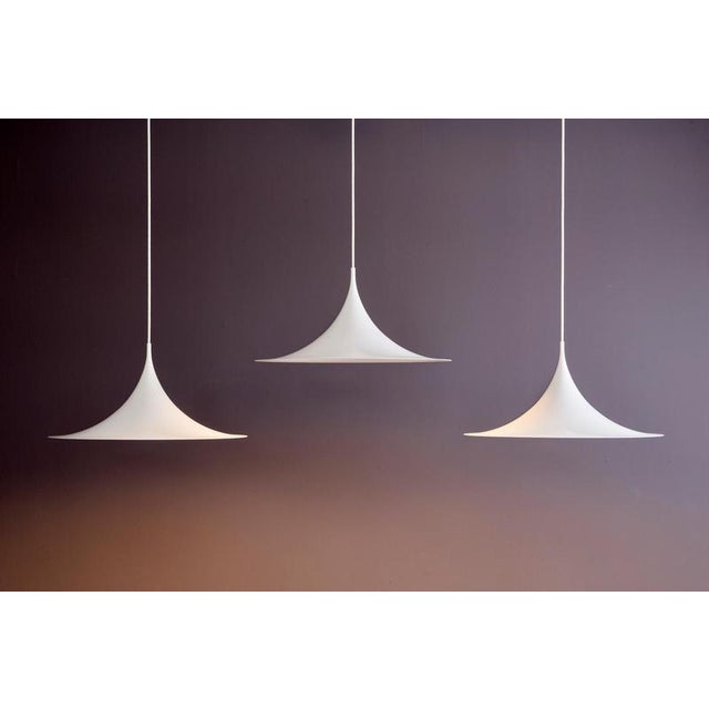Set of three Midi Semi Pendants for Fog & Mørup. Designed by Danish architects Claus Bonderup and Torsten Thorup, the Semi...