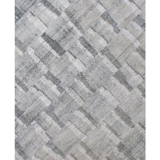 Beautiful hand knotted modern rug. Made of 75% wool and 25% cotton with very modern design and colors, this extremely...