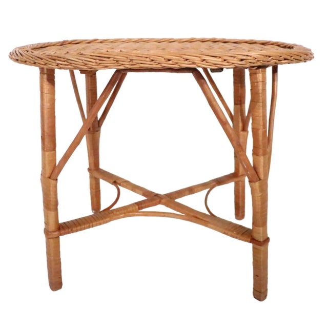 Charming vintage wicker coffee, cocktail table, in original natural wicker finish. The table is structurally sound and...