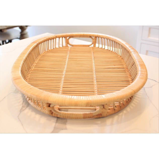 Natural mid-century bamboo/rattan serving tray. Oval shapped with handles.