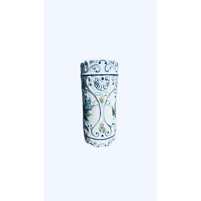 This vintage Portuguese ceramic umbrella stand is hand-painted with blue, green, and rose pink. Features scalloped edges...