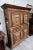Montbéliard two-body cabinet sideboard in molded oak carved with foliage and foliage scrolls, opening to two leaves on the...