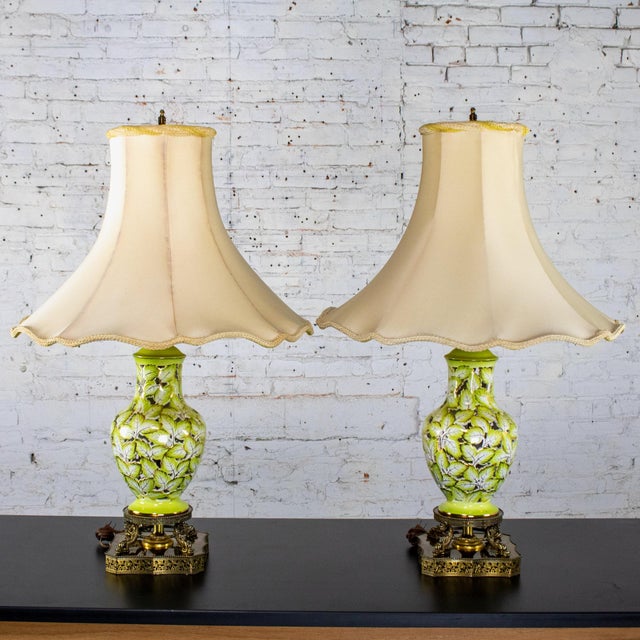 Marvelous vintage Italian pair of table lamps composed of pierced majolica urn shaped bodies with hand painted green...