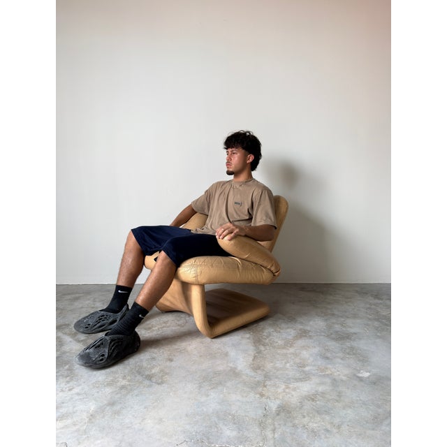 A striking Postmodern statement piece, this vintage hand-shaped chair embodies playful design and sculptural form....