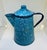 Very charming dainty enamelware coffee pot with lid. Blue speckled enamel metal finish. Lid is separate but fits tightly....