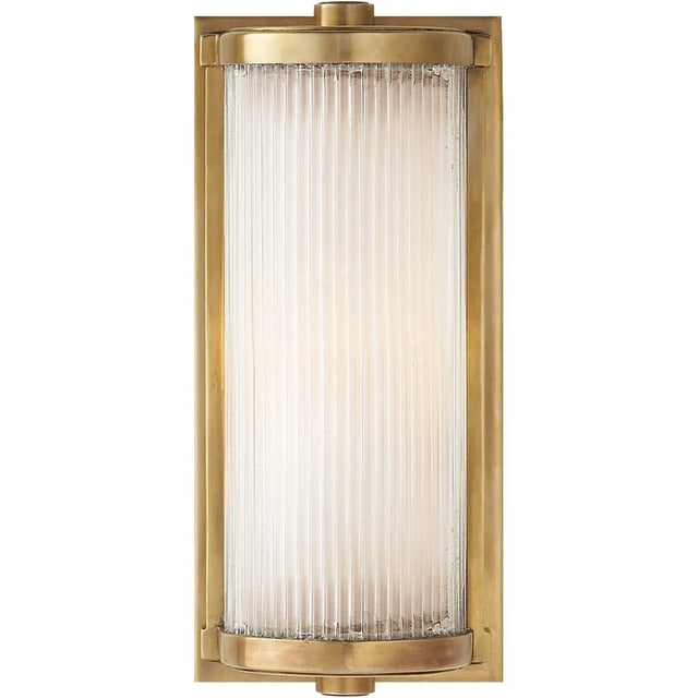 Dresser Short Glass Rod Light in Hand-Rubbed Antique Brass with Frosted Glass Liner Designer: Thomas O'Brien Height:...