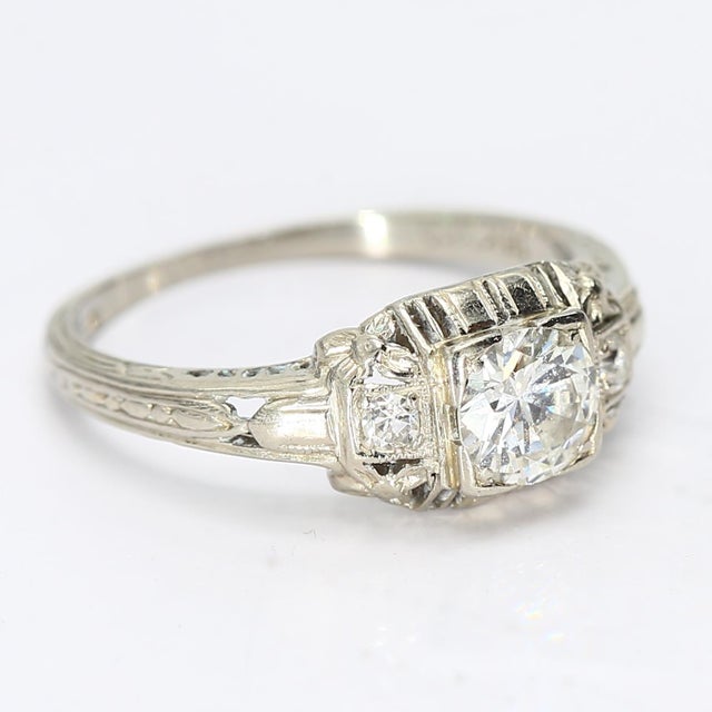 This is a nice vintage ring that toes the line with the art deco style, but still has the playful designs seen around then...