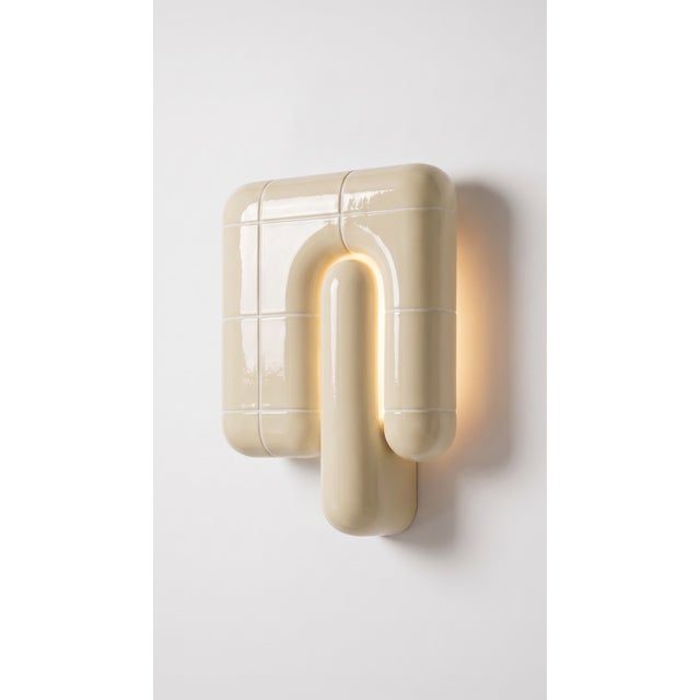 The smallest lamp in the collection, and often the first one people reach for. Its folded form hides the source entirely,...