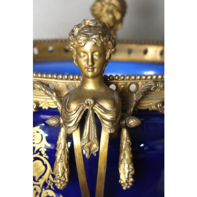 Large Sèvres porcelain bowl with its original gilt bronze mount, 19th century. This bowl is decorated with a gallant scene...