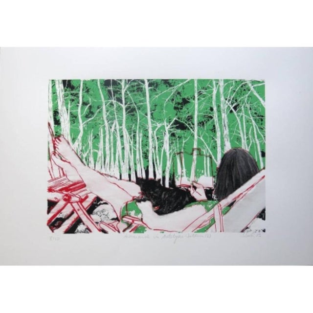 This playful and aesthetic screen print depicts a relaxed scene: a woman engrossed in a book, sitting peacefully in a...