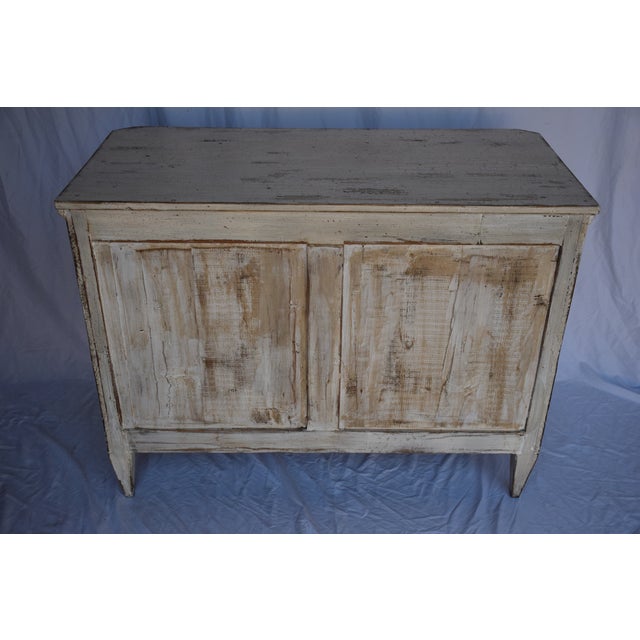 The commode features three nice sized drawers with sufficient storage. Solid wood painted in a soft white, brass handles...