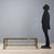 Coffee table with double top, brass-plated metal frame, glass. This piece is attributed to the mentioned designer/maker....