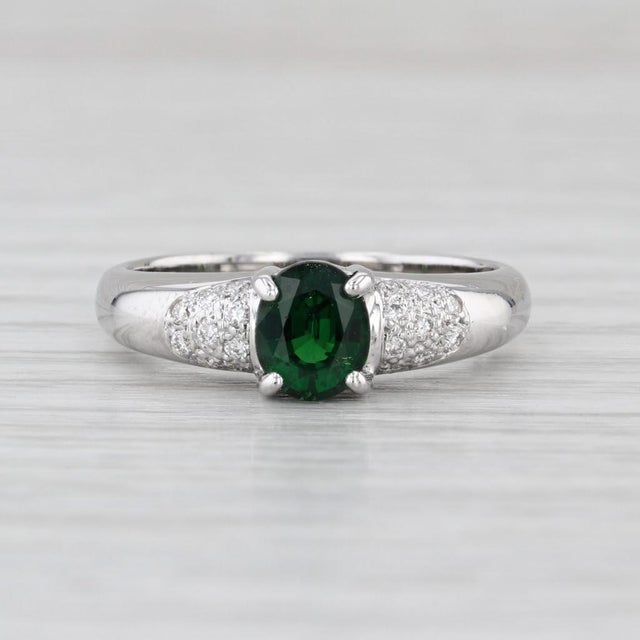 Gemstone Information: - Natural Tsavorite Garnet - Carats - 0.80ct Cut - Oval Brilliant Color - Green - Natural Diamonds -...