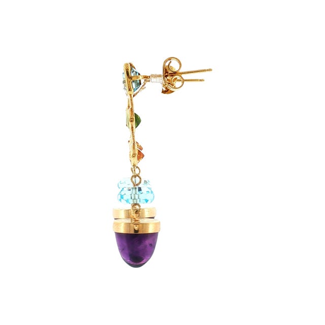 A pair of late 20th-century contemporary 14k gold drop earrings. Featuring cabochon amethyst, briolette blue topaz,...