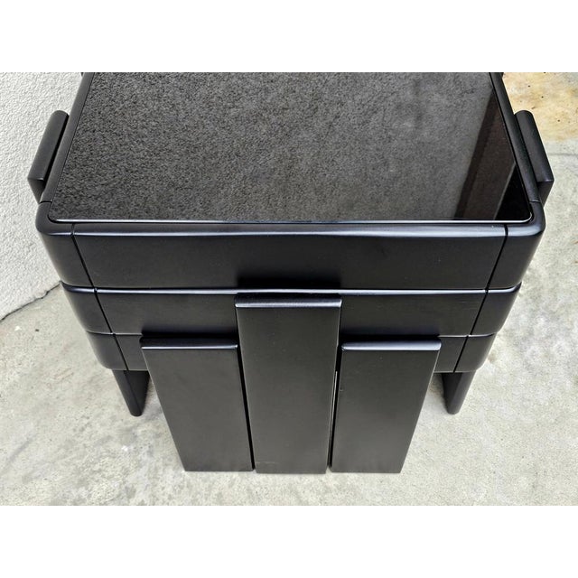 This listing features mid century modern set of 3 nesting tables, done in solid beech wood painted black, with black glass...