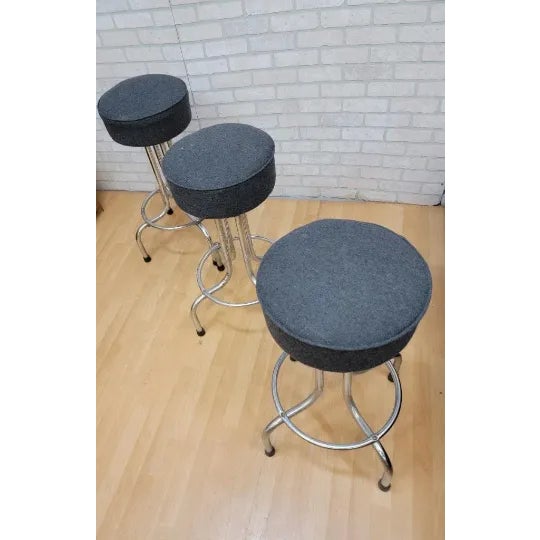 Mid-Century Modern Vintage Industrial Swivel Bar Stools Newly Reupholstered in a Charcoal Wool - 3 Piece Set For Sale - Image 3 of 8